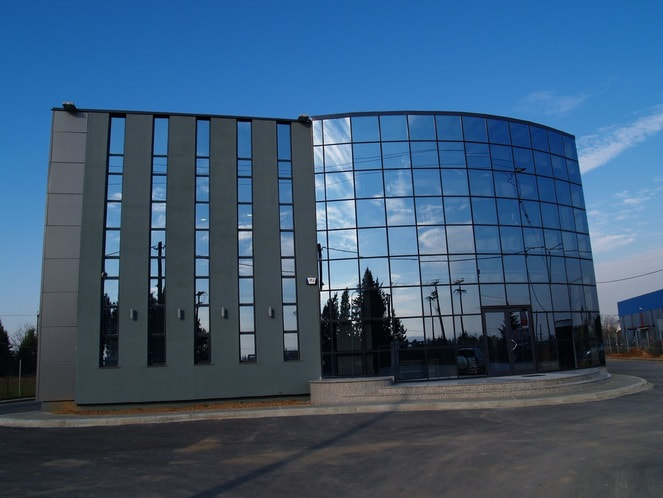 Front of the glass building of Tzilvelis Company located in Thessaloniki